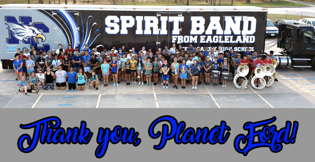 The Spirit Band standing with their new custom trailer.
